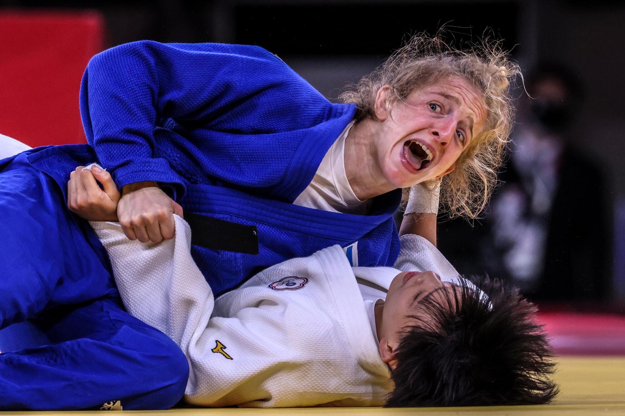 Israel’s Shira Rishony yells out as she defeats Chen-hao Lin in judo at the Tokyo Olympics.