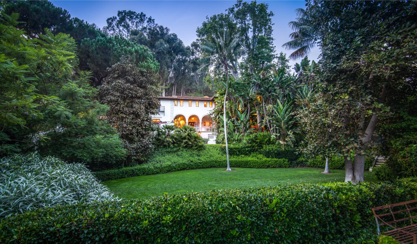 The leafy spread includes a 1930s mansion, guesthouse, gatehouse and 74-foot swimming pool surrounded by lawns, gardens and citrus groves.