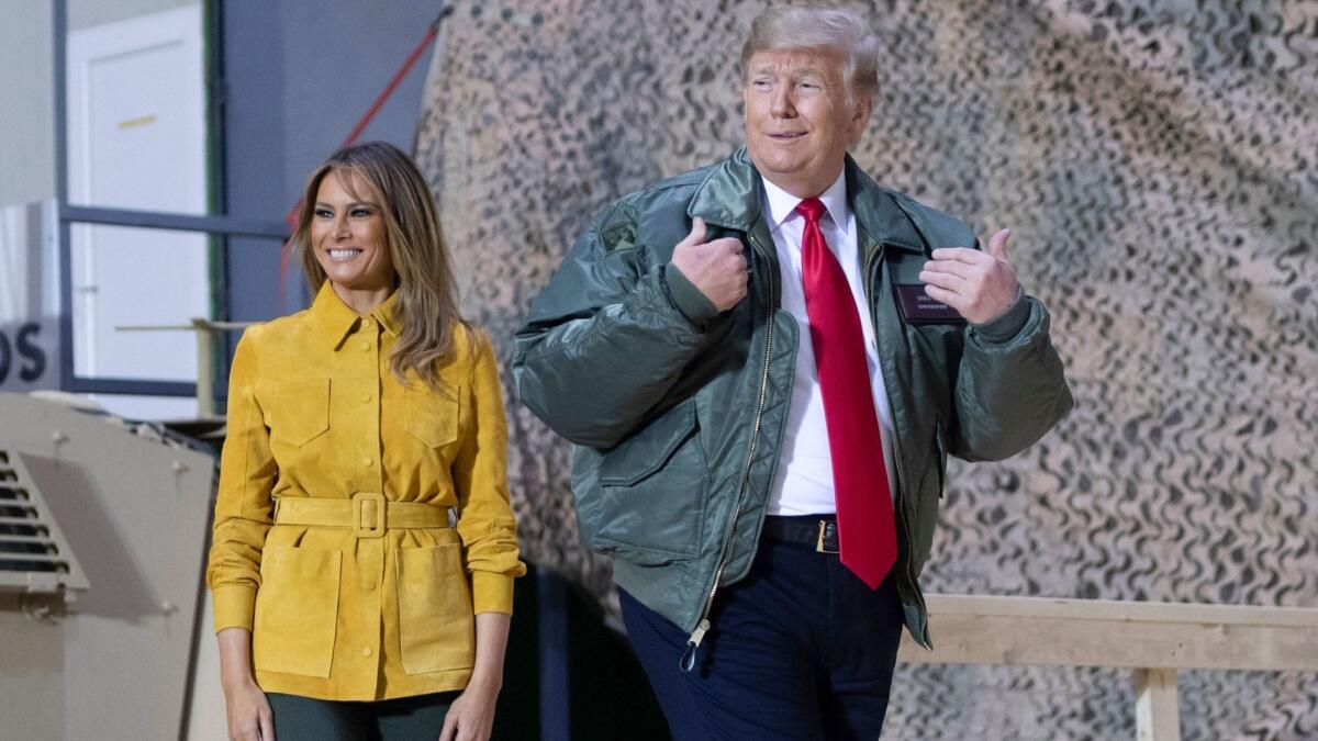 President Trump and First Lady Melania Trump arrive at Asad Air Base in Iraq on Wednesday.