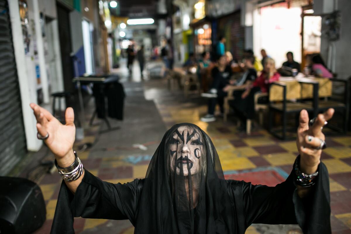 El Muertho is a Tijuana street performer known for his KISS-inspired outfits and devilish song lyrics. Here he poses for a portrait in Tijuana's Pasaje Rodriguez, an artsy arcade just off of Avenida Revolución.