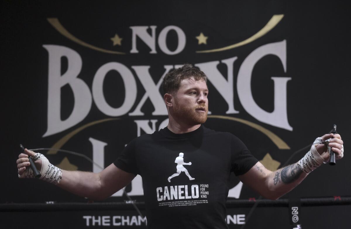 Boxer Canelo Álvarez jumps rope in a gym