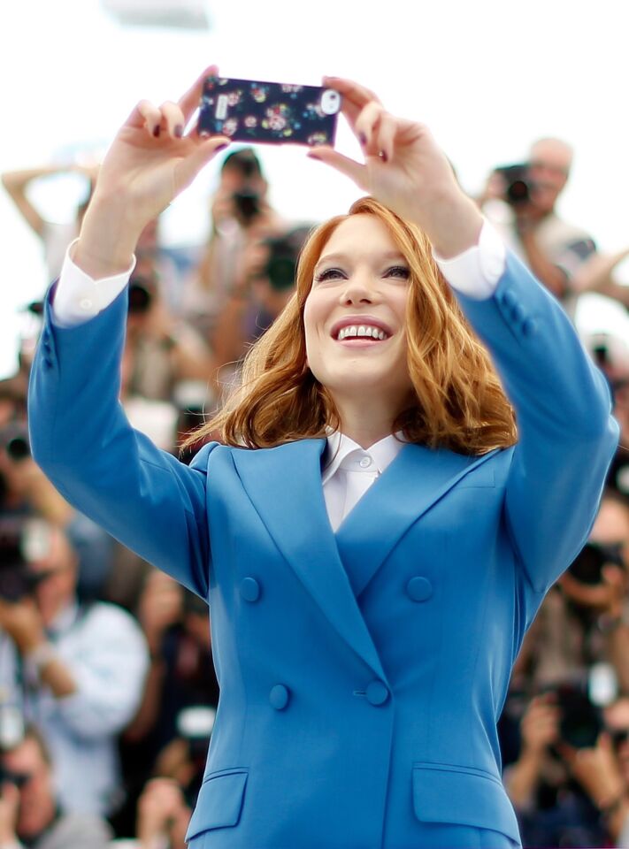Lea Seydoux poses for a selfie during a photocall for the film "Saint-Laurent" at the 67th edition of the Cannes Film Festival in Cannes, southern France, on May 17, 2014.