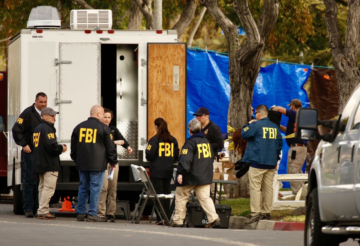 FBI agents search the Long Beach home of Stephen Beal, who was arrested in connection with a fatal blast at an Aliso Viejo day spa that claimed the life of his ex-girlfriend and business partner last year.