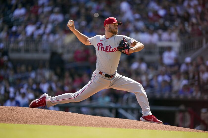 Philadelphia Phillies starting pitcher Zack Wheeler (45) delivers in the first inning of a baseball game against the Atlanta Braves, Saturday, May 27, 2023, in Atlanta. (AP Photo/Brynn Anderson)