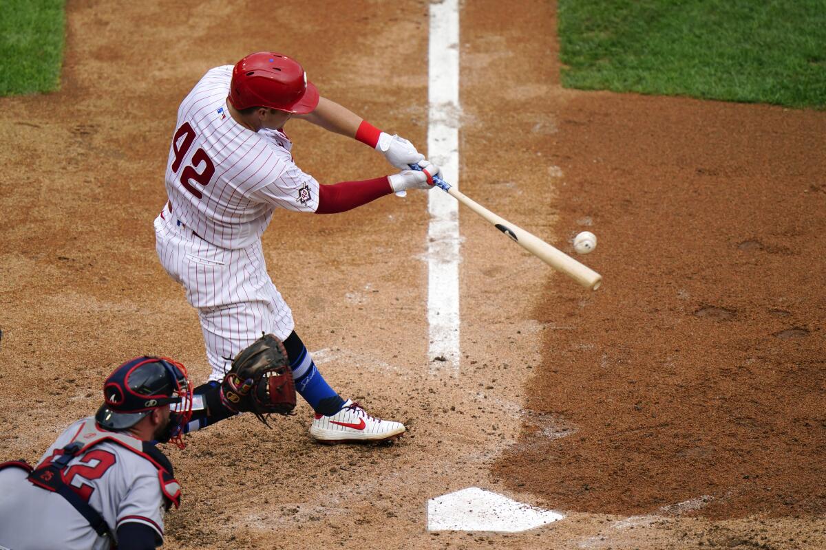 Phillies left fielder Rhys Hoskins hits a three run home run