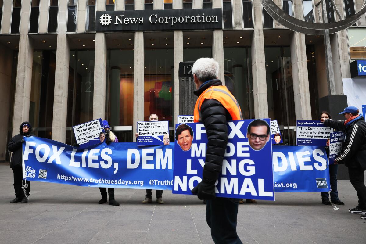 Demonstrators protest outside News Corp. headquarters in New York City on Feb. 21.