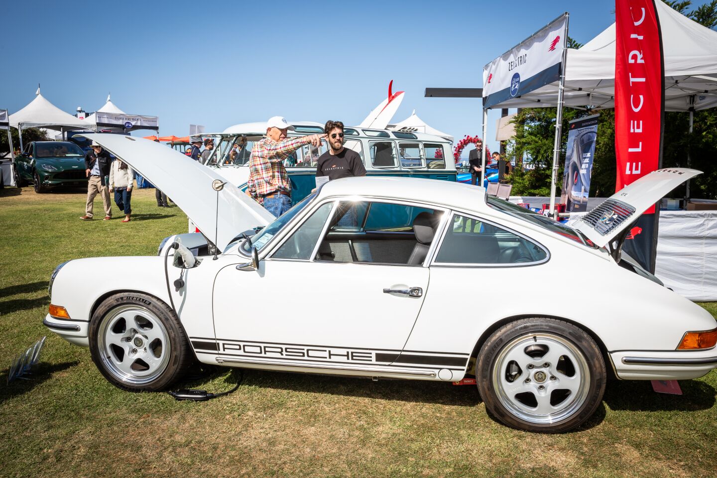 Aaron Weiss (left) and Zelectric's Robert McCarthy talk next to a converted electric 1969 Porsche 912 Restomod.