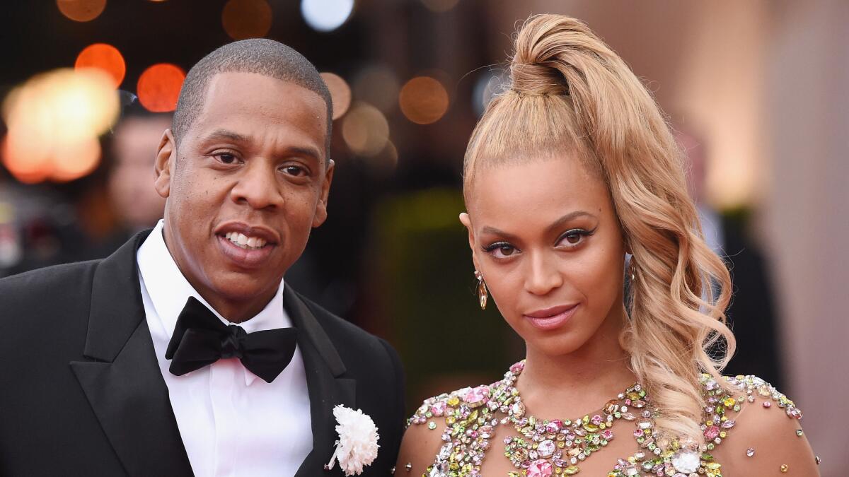 Jay Z, shown with wife Beyonce in May, rocked out in the crowd Saturday night while Beyonce was headlining the Budweiser Made in America festival, which he curated.
