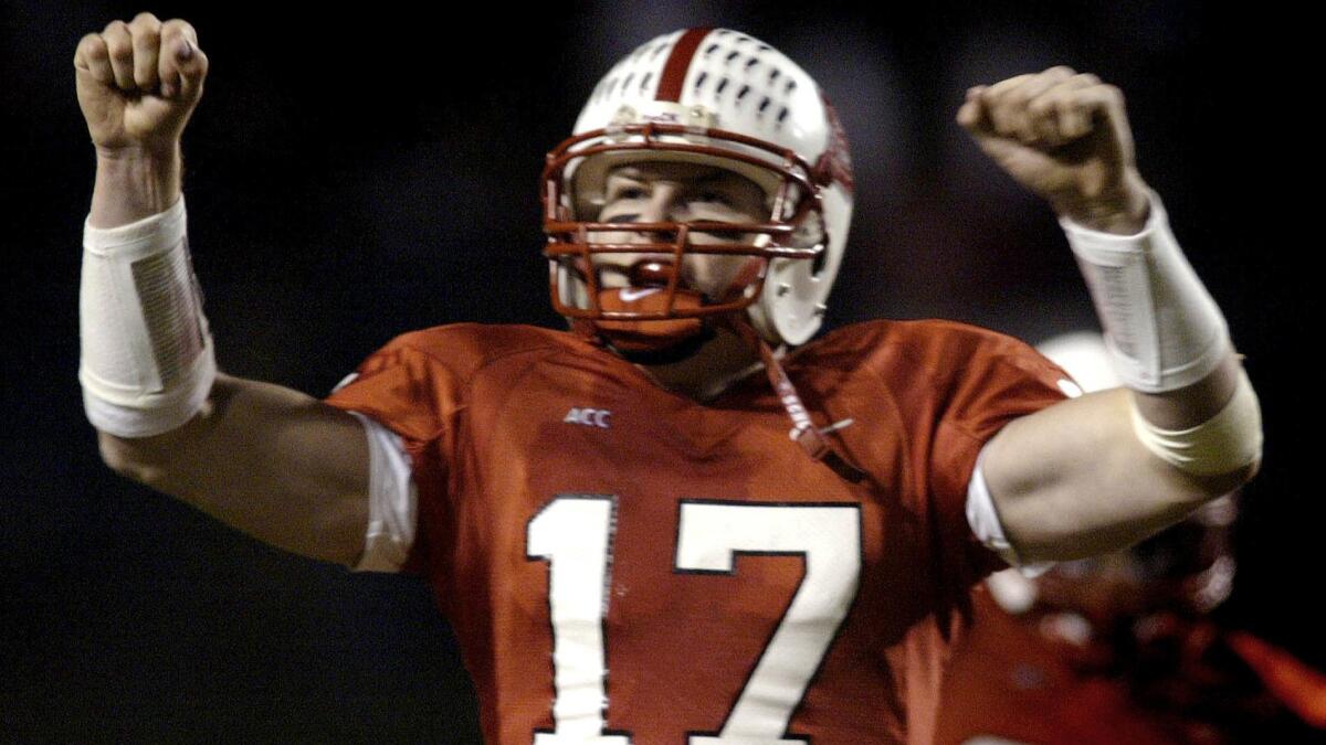 Former North Carolina State quarterback Philip Rivers (17) celebrates during his team's 17-7 upset of No. 14 Florida State on Nov. 23, 2002.