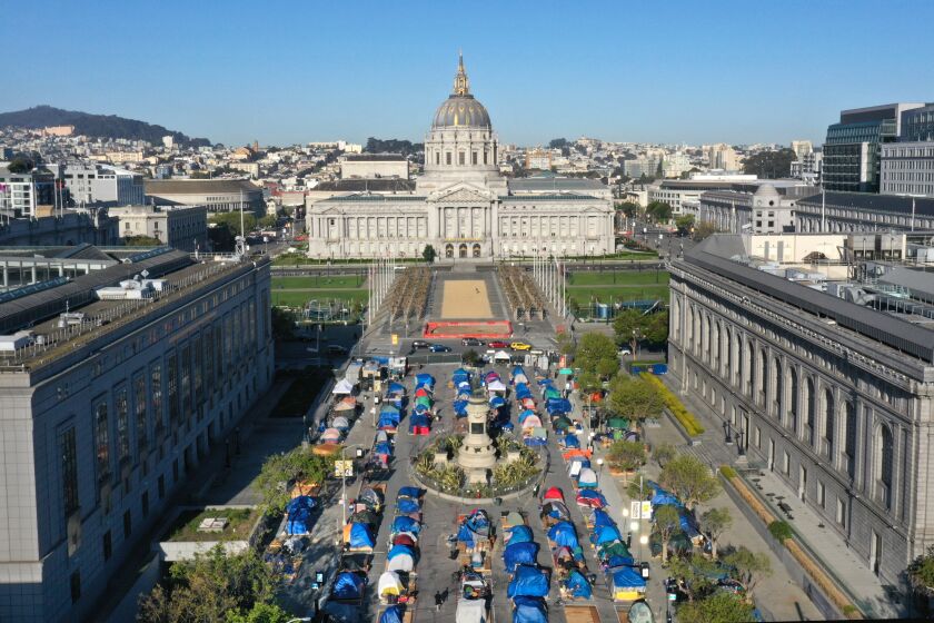 San Francisco, CA—April 3, 2021—The Safe Sleeping Village at Fulton Street in downtown San Francisco is run by Urban Alchemy proves tents, toilets, showers, and food to unhoused people. (Carolyn Cole / Los Angeles Times)