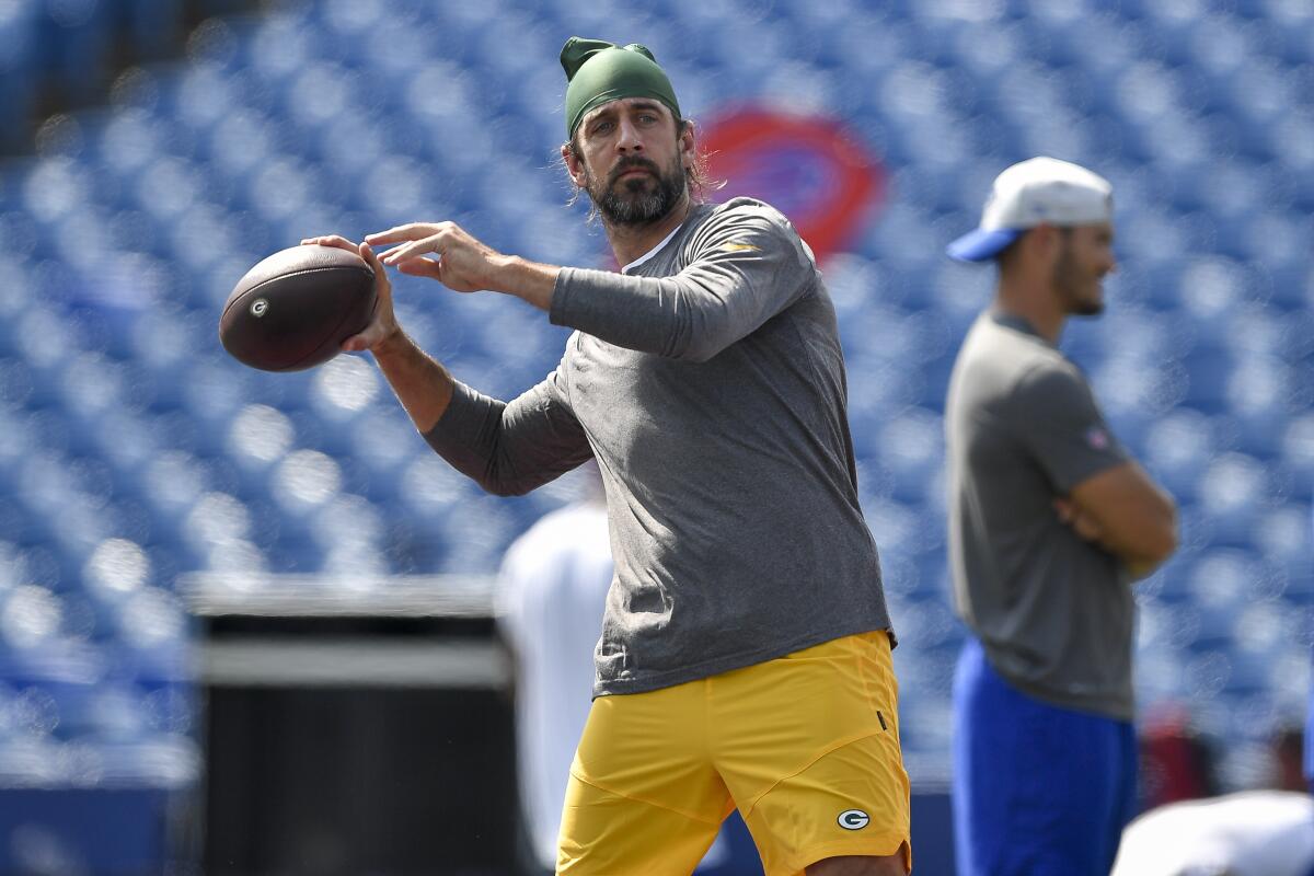 Green Bay Packers quarterback Aaron Rodgers warms up before a preseason game.