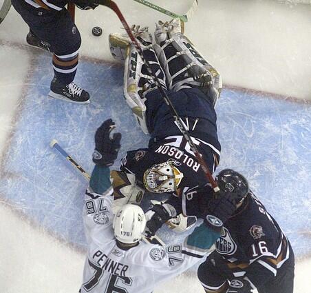 Mighty Ducks' Dustin Penner celebrates his first period goal past Edmonton Oilers goaltender Dwayne Roloson.