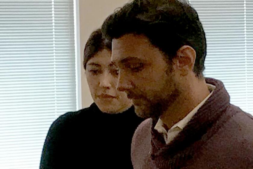 El Cajon Councilman Bessmon “Ben” Kalasho, foreground, and his wife, Jessica Kalasho, in court last month. The judge in the civil fraud and defamation lawsuit recused himself from the case.