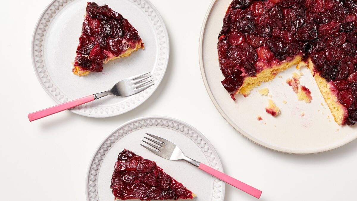 Lightly glazed fresh cherries form a substantial topping for a flavorful almond paste-based cake, perfect for dessert, tea time or breakfast.