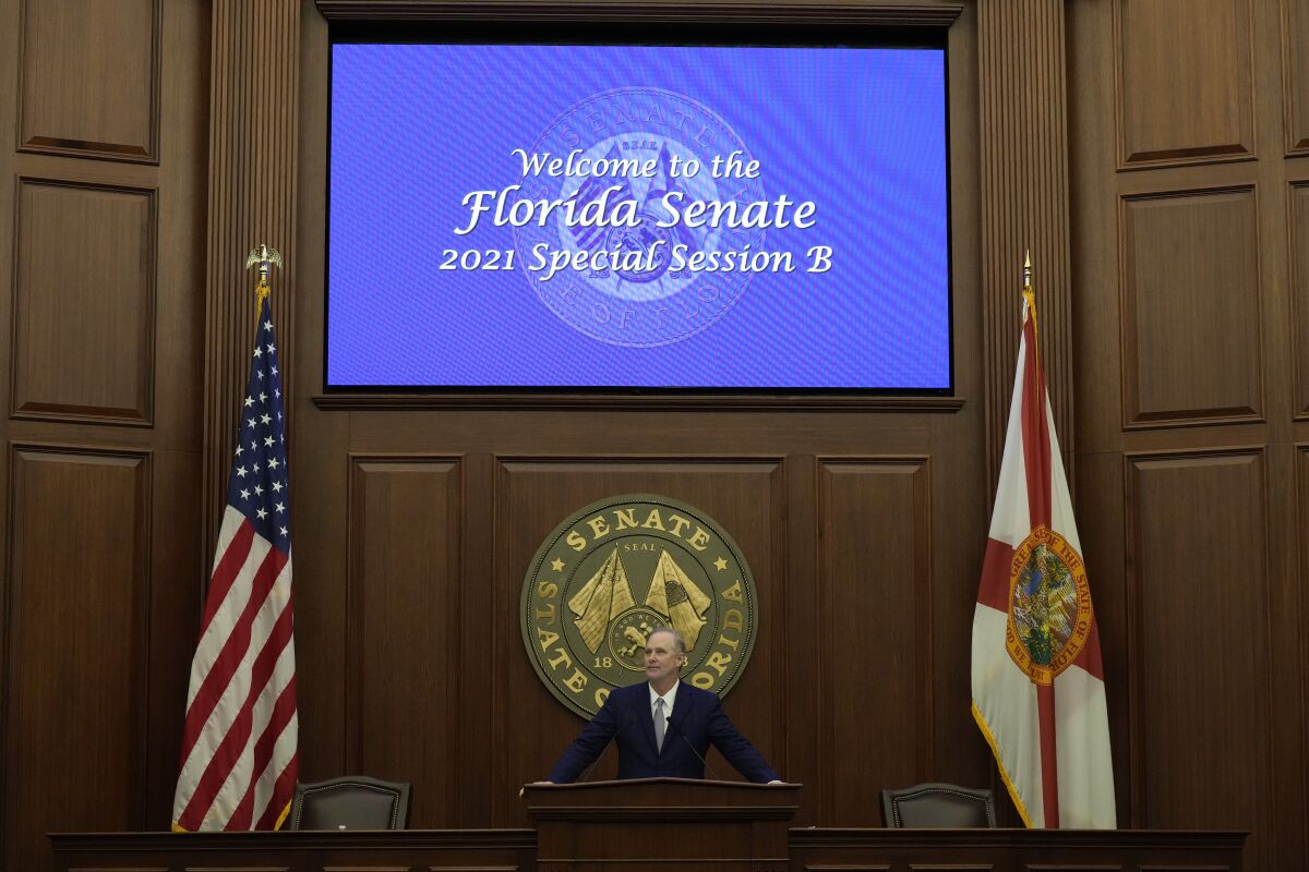 Florida Senate President Wilton Simpson presides over the opening of a special legislative session targeting COVID-19 vaccine mandates, Monday, Nov. 15, 2021, in Tallahassee, Fla. The special session was called by Florida Gov. Ron DeSantis, who has aggressively opposed the application of vaccine and masking mandates in the state.(AP Photo/Rebecca Blackwell)
