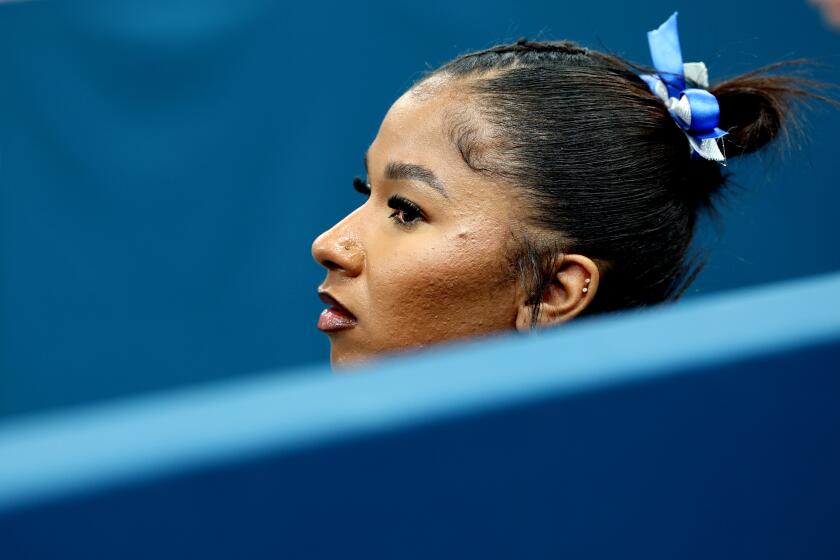 PARIS, FRANCE July 24, 2024-U.S. gymnast Jordan Chiles takes a break during podium training.