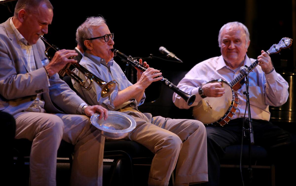 Woody Allen, center, performs with the Eddy Davis New Orleans Jazz Band at the Orpheum Theatre in Los Angeles on Saturday.
