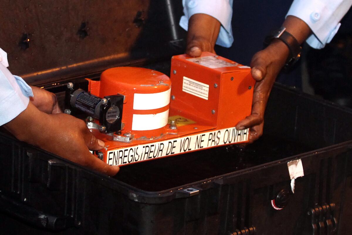 Indonesian military personnel exhibit the cockpit voice recorder of the AirAsia flight QZ8501 after its recovery from the sea floor off the coast of Pangkalan Bun on Jan. 13, 2015.