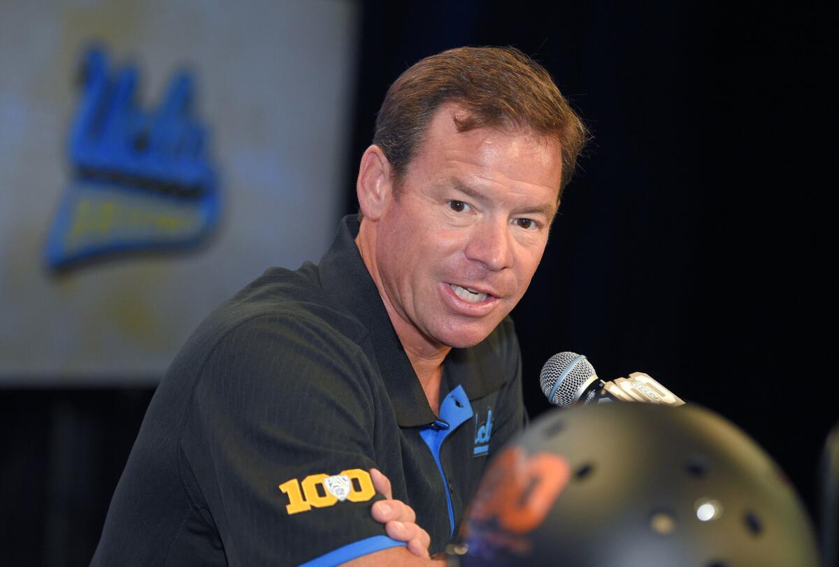 UCLA Coach Jim Mora speaks to reporters July 30, 2015, during Pac-12 Conference media days at Warner Bros. Studios in Burbank.