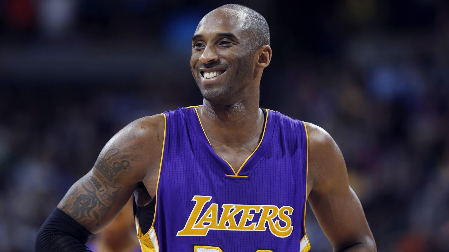Lakers guard Kobe Bryant smiles during the fourth quarter of a 111-103 win over the Denver Nuggets on Dec. 30, 2014.