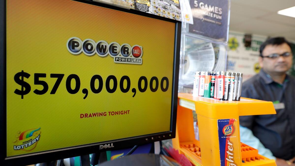 A convenience store in Chicago displays a Powerball sign Saturday.