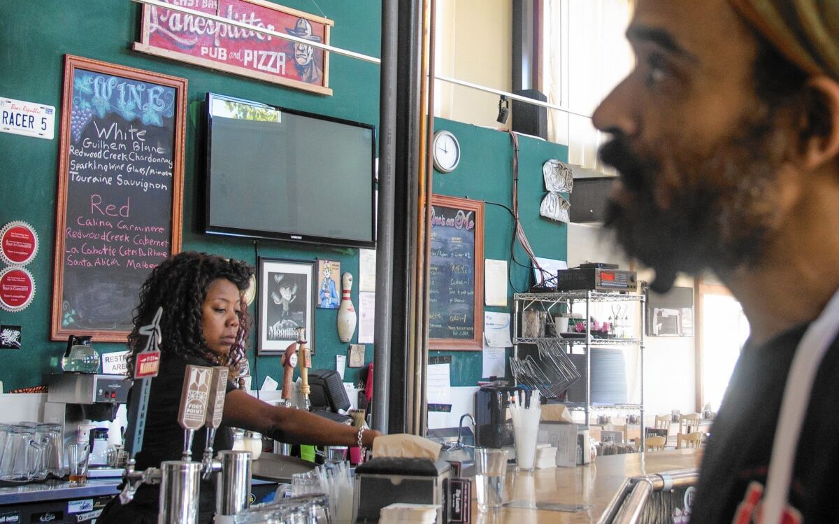 Nina Gates, 44, and Ira Gibson, 39, are employees of Lanesplitter Pizza & Pub in Emeryville, Calif., whose workers earn $15 to $25 an hour as part of a business model that also did away with gratuities and raised prices, making meals at all five locations “sustainably served … no tips necessary.”