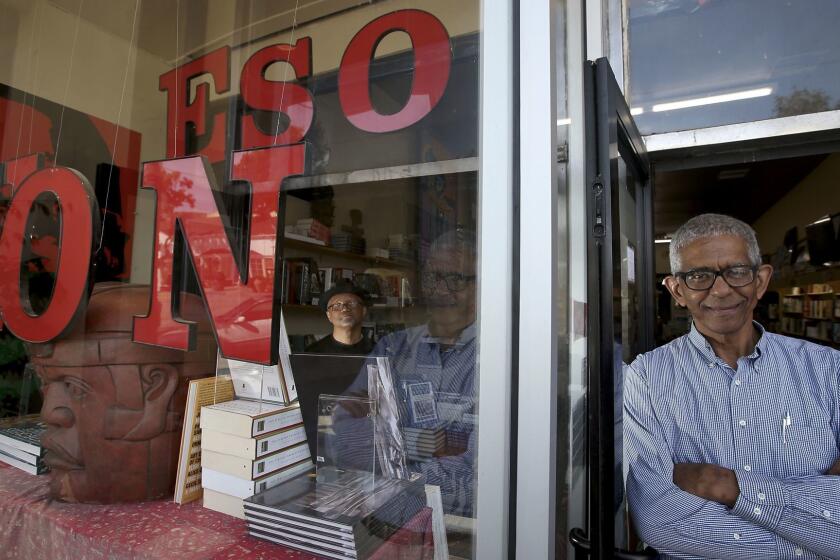 LOS ANGELES, CALIF. - APRIL 24, 2017. Tom Hamilton, left, and James Fuagte are the founders and owners of Eso Won Books in Leimert Park. (Luis Sinco/Los Angeles Times)
