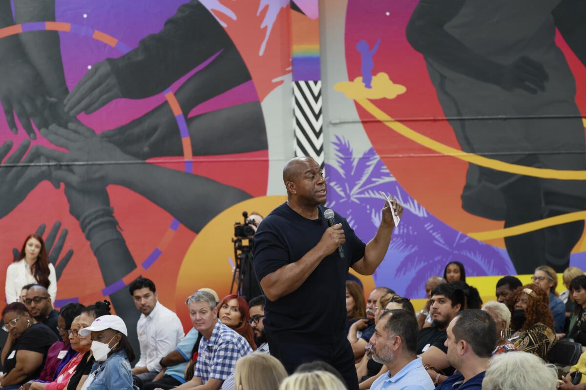 Lakers legend Magic Johnson speaks at the Crenshaw Family YMCA on Tuesday.