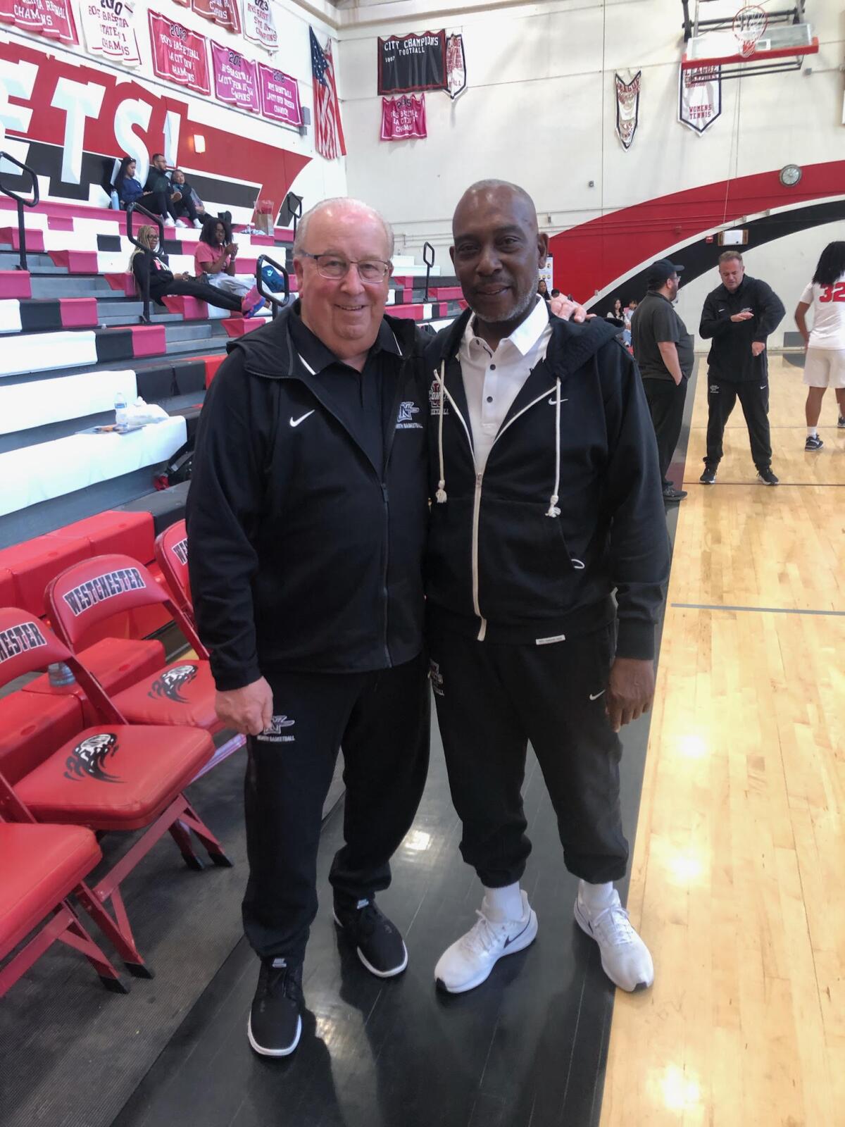 Westchester coach Dewitt Cotton stands next to former coach Ed Azzam.