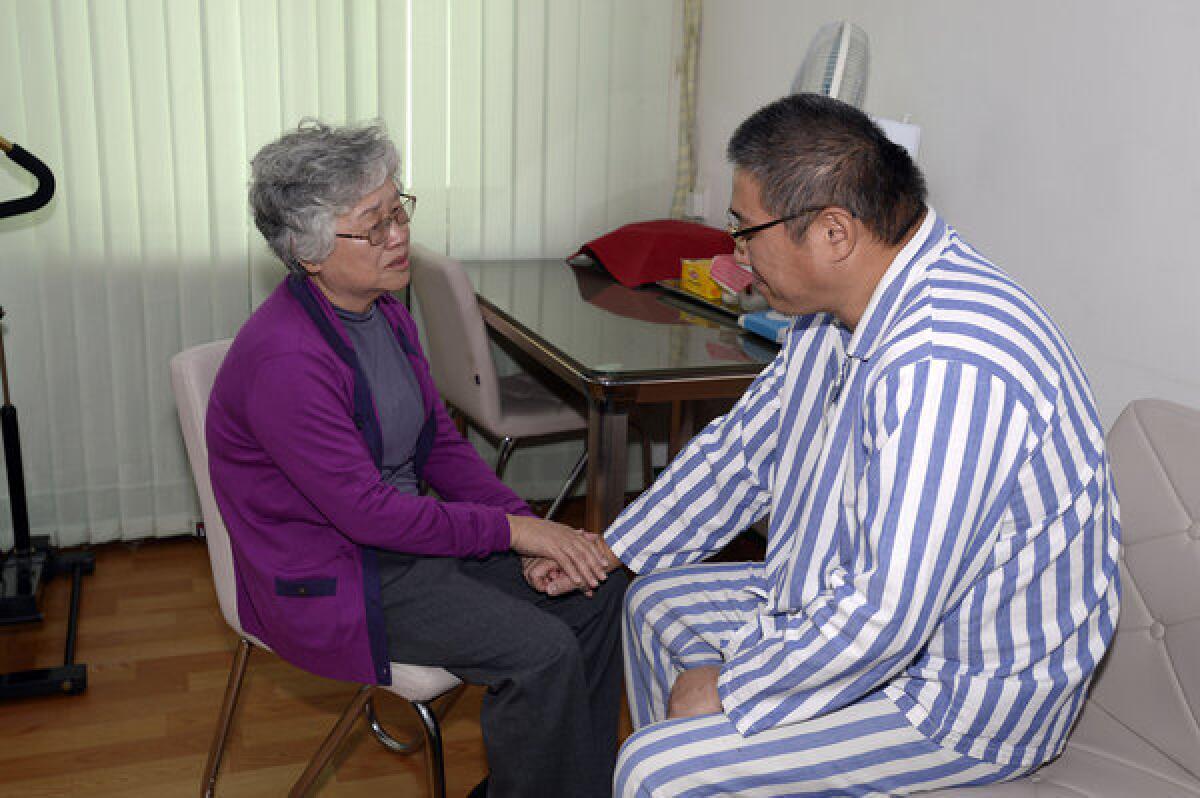 Imprisoned American Kenneth Bae visits with his mother, Myunghee, at a hospital in Pyongyang, North Korea.