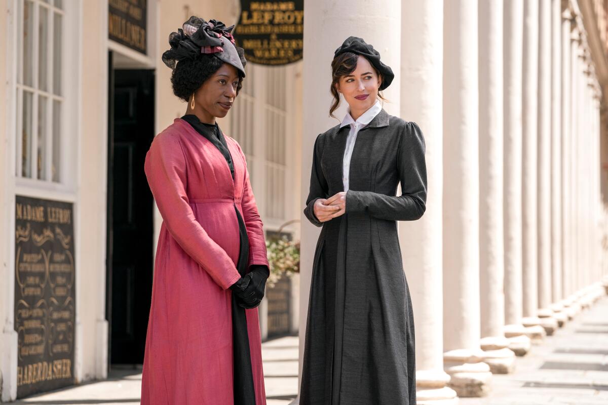Left to right, Nikki Amuka-Bird as Lady Russell and Dakota Johnson as Anne Elliot in “Persuasion.”