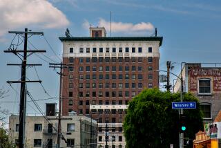 Los Angeles, CA - May 07: The Mayfair Hotel, a 15-story hotel in Westlake/MacArthur Park, Mayor Karen Bass' team is in talks to purchase to use as interim homeless housing on Sunday, May 7, 2023 in Los Angeles, CA. (Jason Armond / Los Angeles Times)