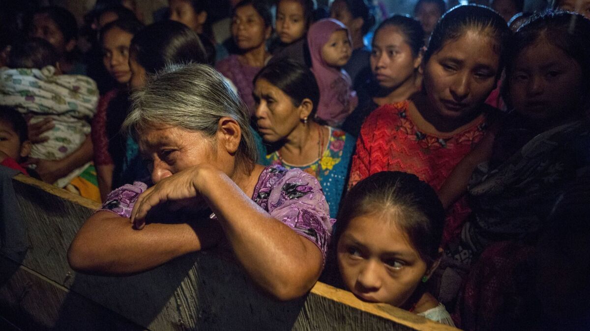Elvira Choc grieves as she attends a memorial service for her 7-year-old granddaughter, Jakelin Caal, in San Antonio Secortez, Guatemala, on Dec. 24.