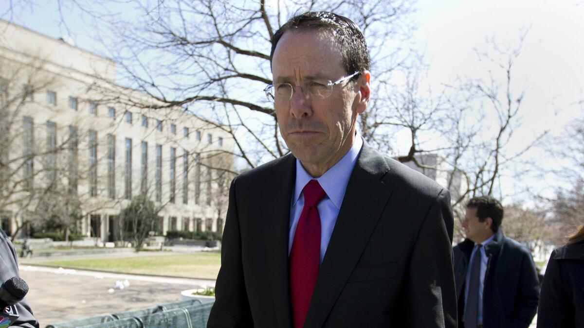 AT&T Inc. Chief Executive Randall Stephenson leaves a federal courthouse in Washington on Thursday after listening to opening arguments in the Justice Department antitrust suit to block the company's purchase of Time Warner Inc.