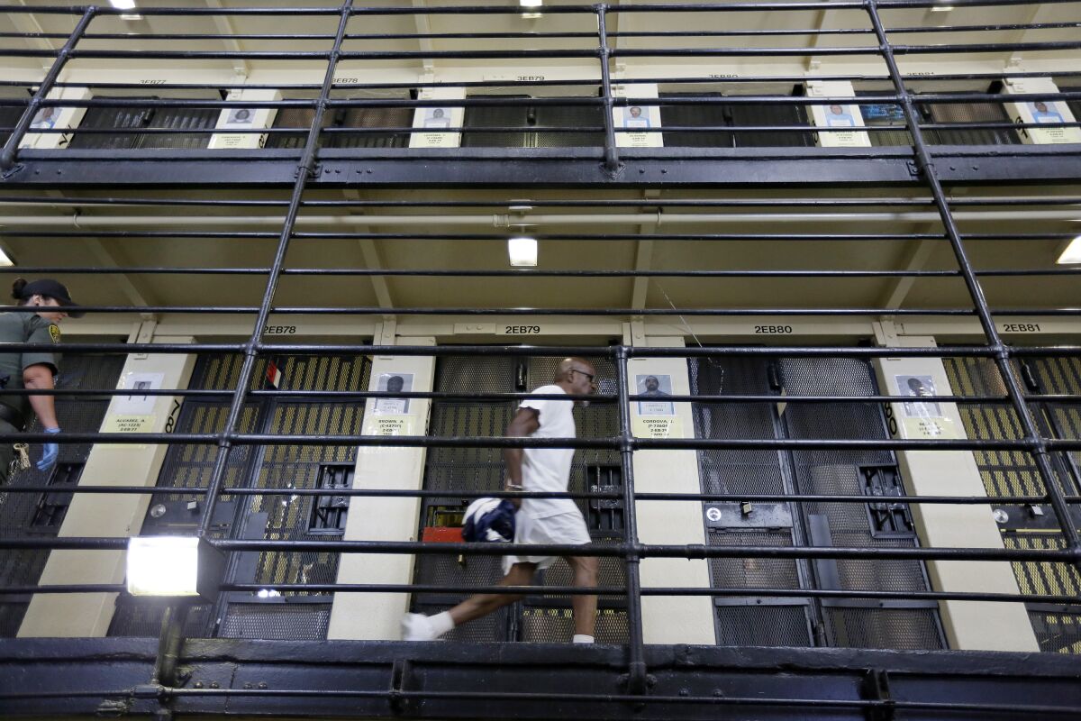 A condemned inmate walks along the east block of death row at San Quentin State Prison in 2016.