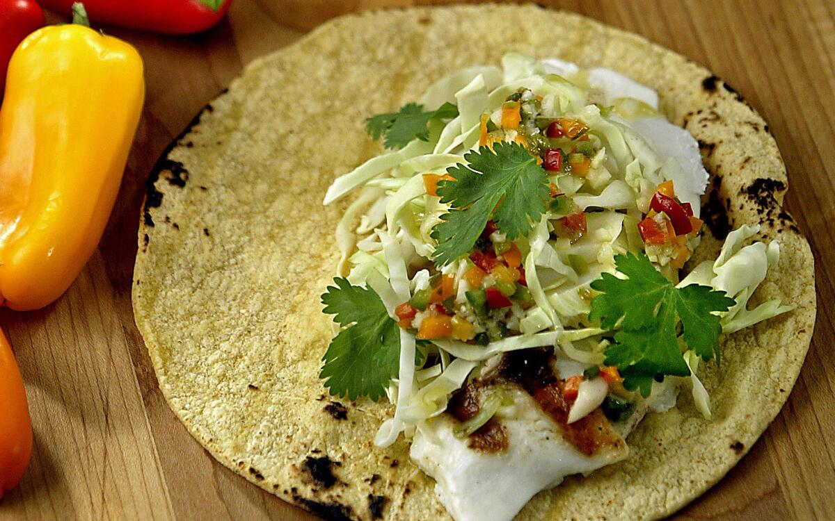 Grilled halibut soft tacos with lime-garlic vinaigrette