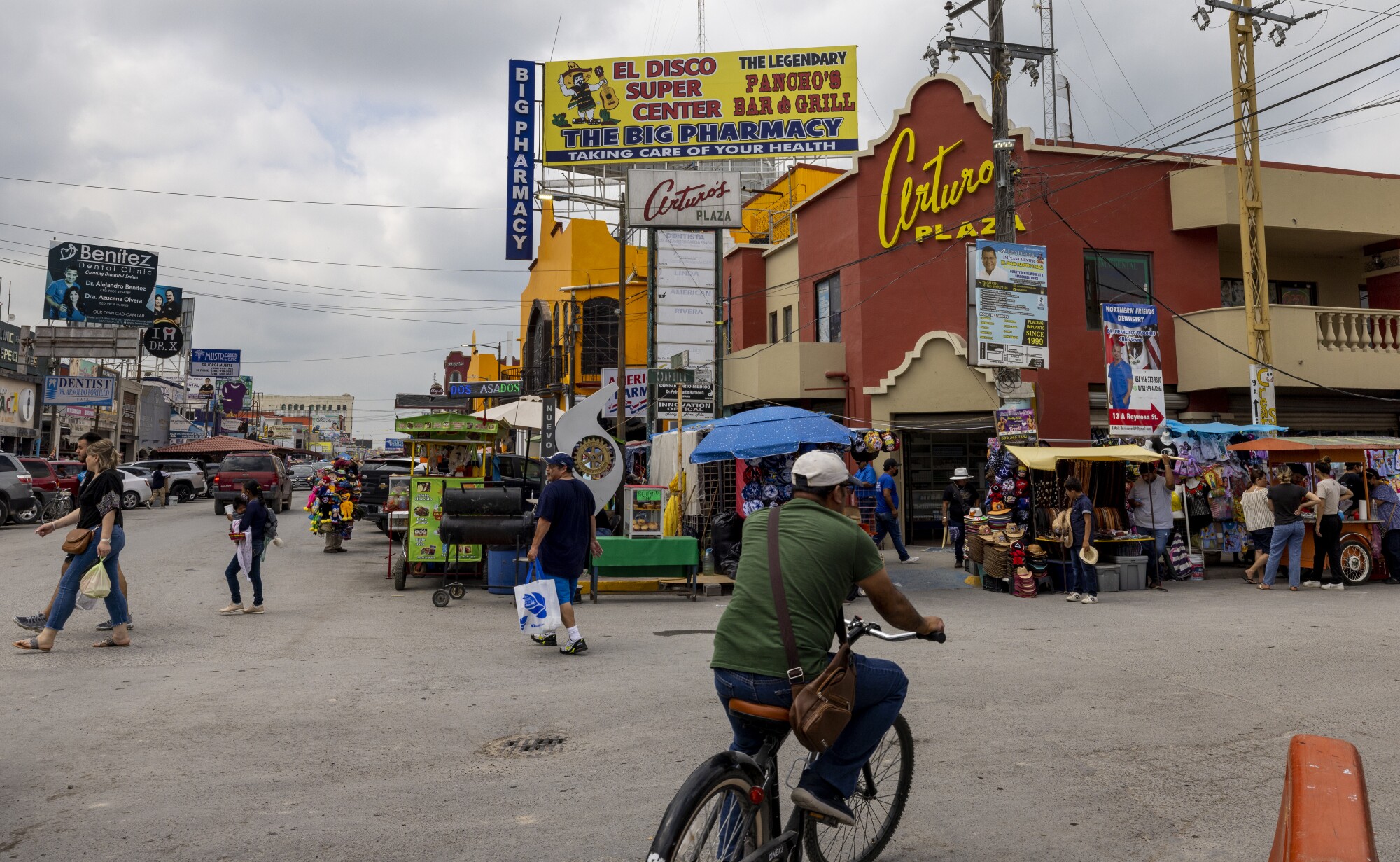 A busy street with crowds of people in Nuevo Progreso, Mexico.