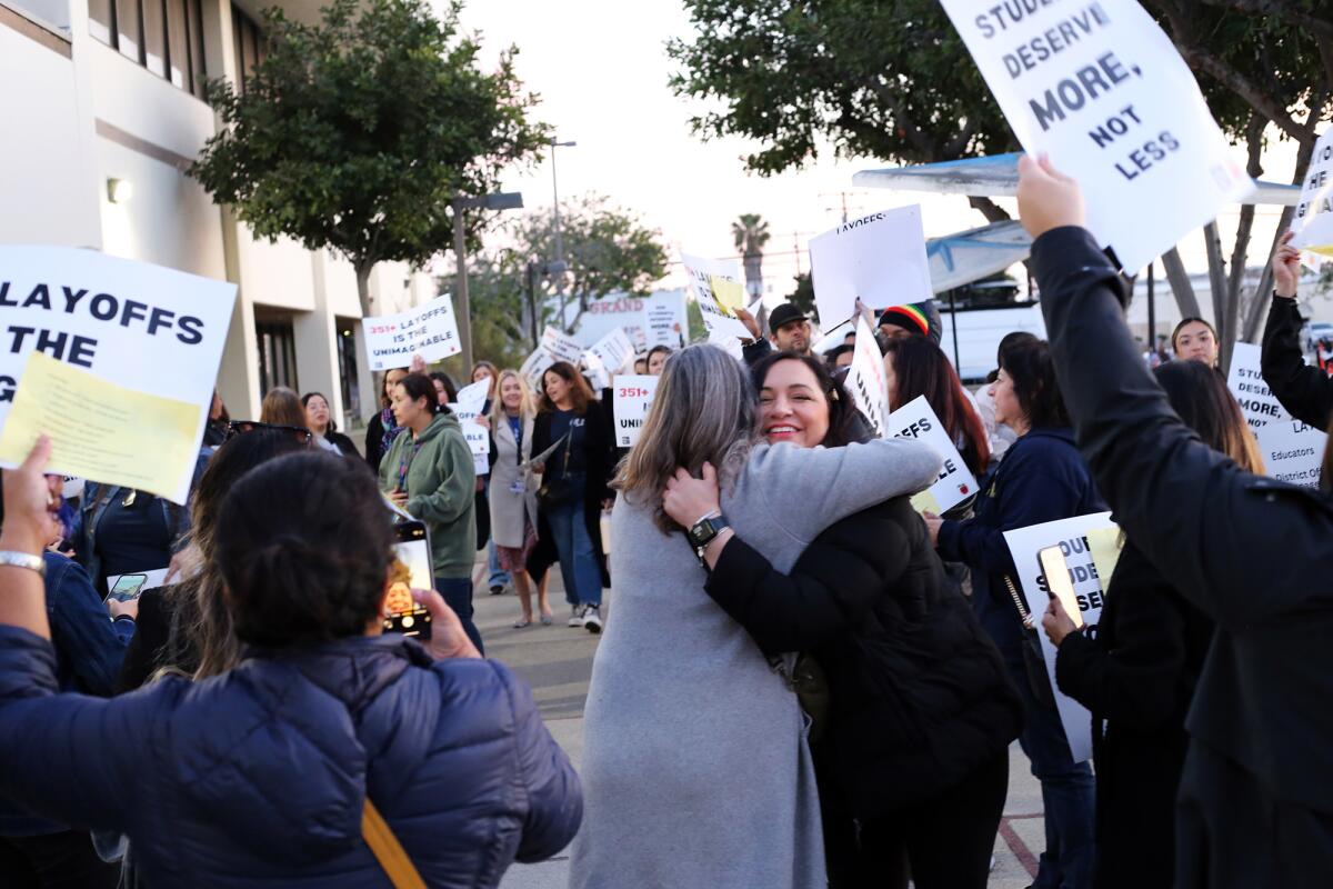 Educators and community members rallying against layoffs during a January Santa Ana Unified school board meeting.