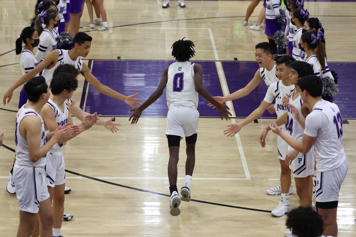 Makai Brown runs onto the court.