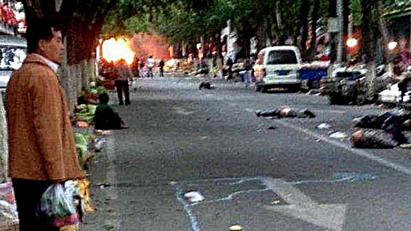 Victims lie on a street after a terrorist attack in Urumqi, in northwest China's Xinjiang region.