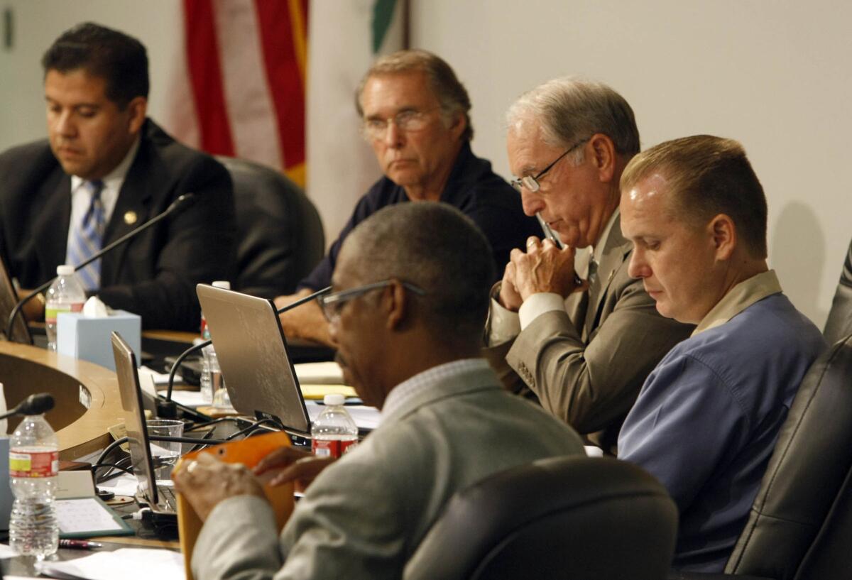 San Bernardino Councilman Chas Kelley, far right, resigned Thursday and quit running for mayor after pleading guilty to perjury.