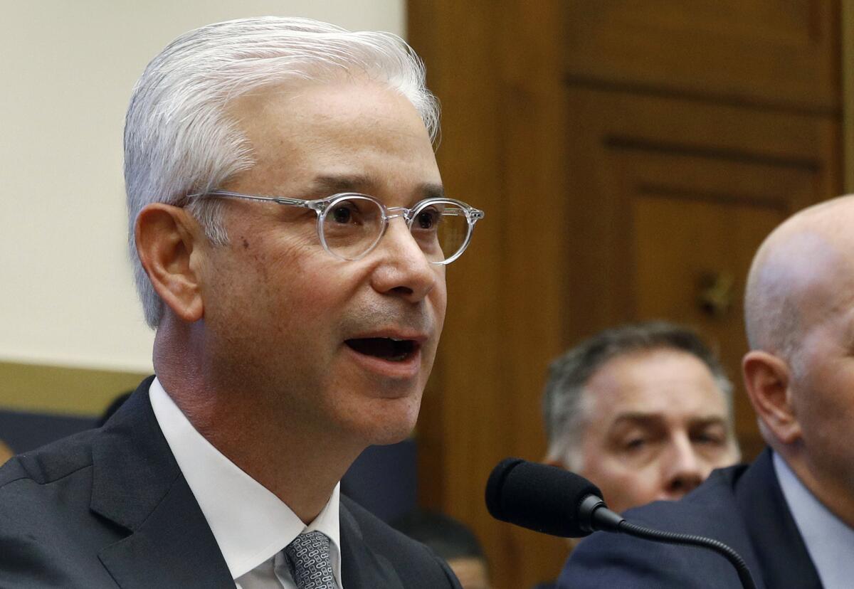 Charles Scharf, then chief executive of Bank of New York Mellon, testifies before the House Financial Services Committee in Washington last April. Wells Fargo named Scharf to be its new chief executive, operating out of New York.