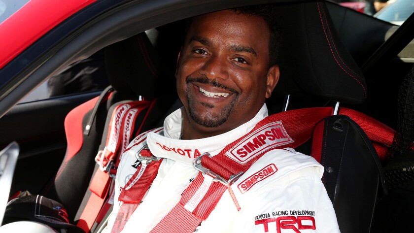 Alfonso Ribeiro waits for the start of a practice session at the Grand Prix of Long Beach.