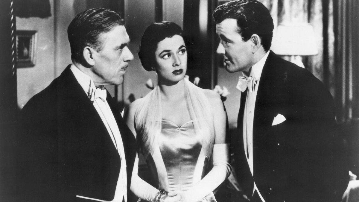 Leo G. Carroll, left, Ruth Roman and Robert Walker, in the 1951 thriller "Strangers on a Train."