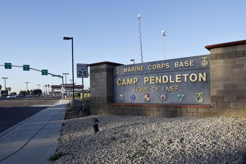 FILE - This Nov. 13, 2013 file photo shows the main gate of Camp Pendleton Marine Base at Camp Pendleton, Calif. One Marine was killed and 18 others were injured Thursday, Sept. 10, 2015, in a vehicle rollover accident on the base. No details about the accident were immediately released, nor were the identities of the dead or injured.(AP Photo/Lenny Ignelzi, File)