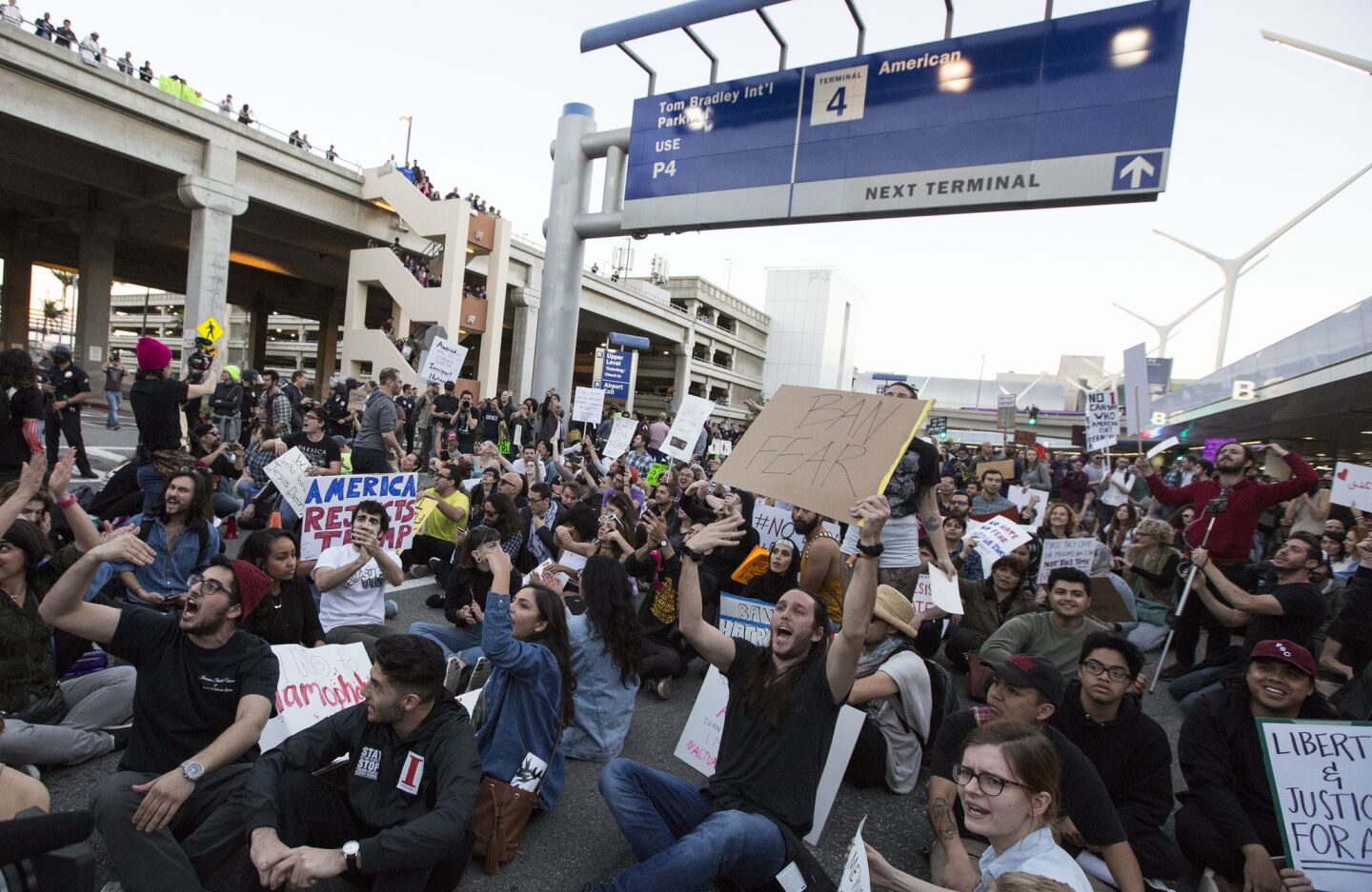 Hundreds block traffic on the arrival level of the Tom Bradley International Terminal to protest President Trump's immigration order.