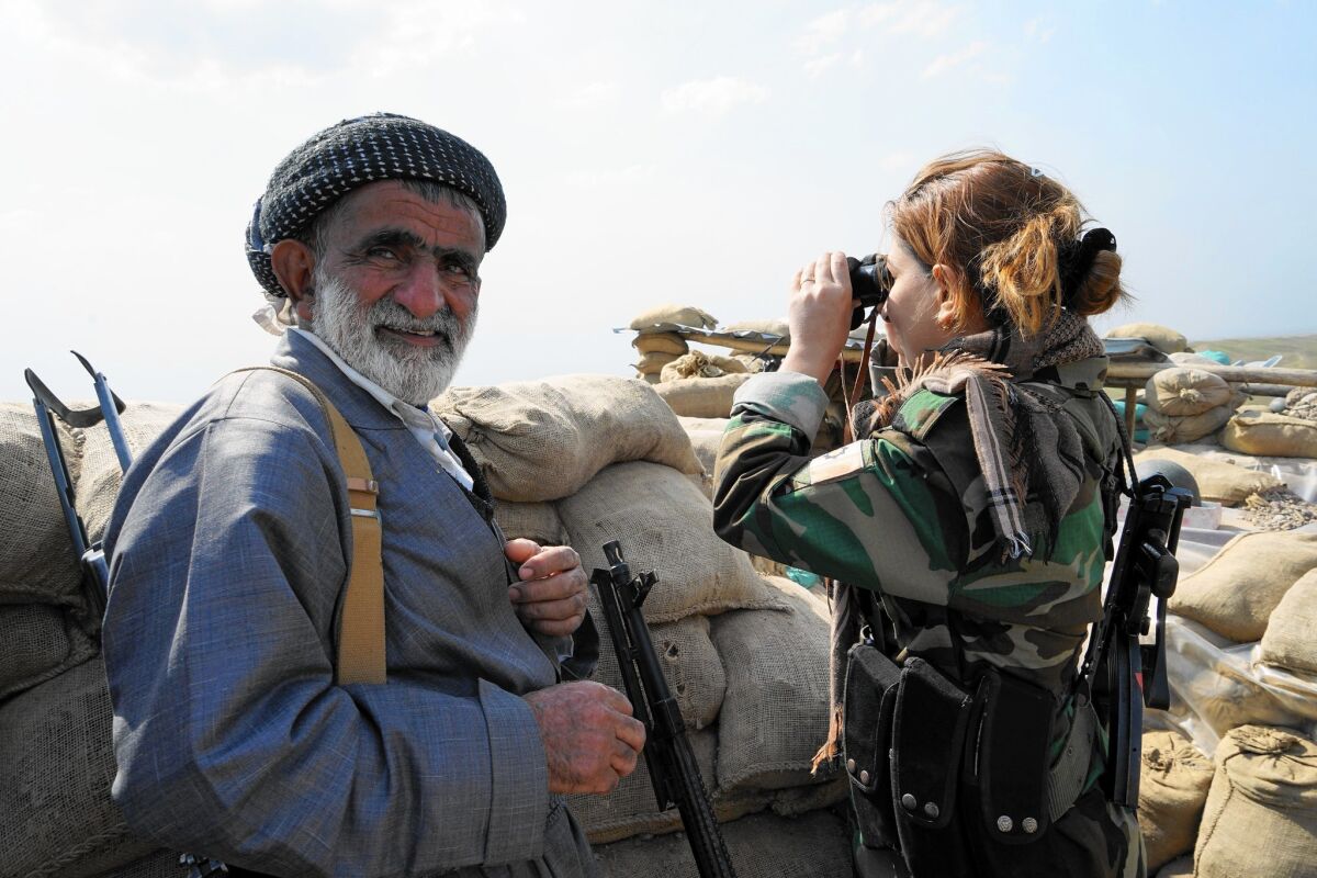 Iranian Kurdish militia fighters Zahir Ali and his daughter Zohra Zahir, 23, are fighting Islamic State militants in northern Iraq.