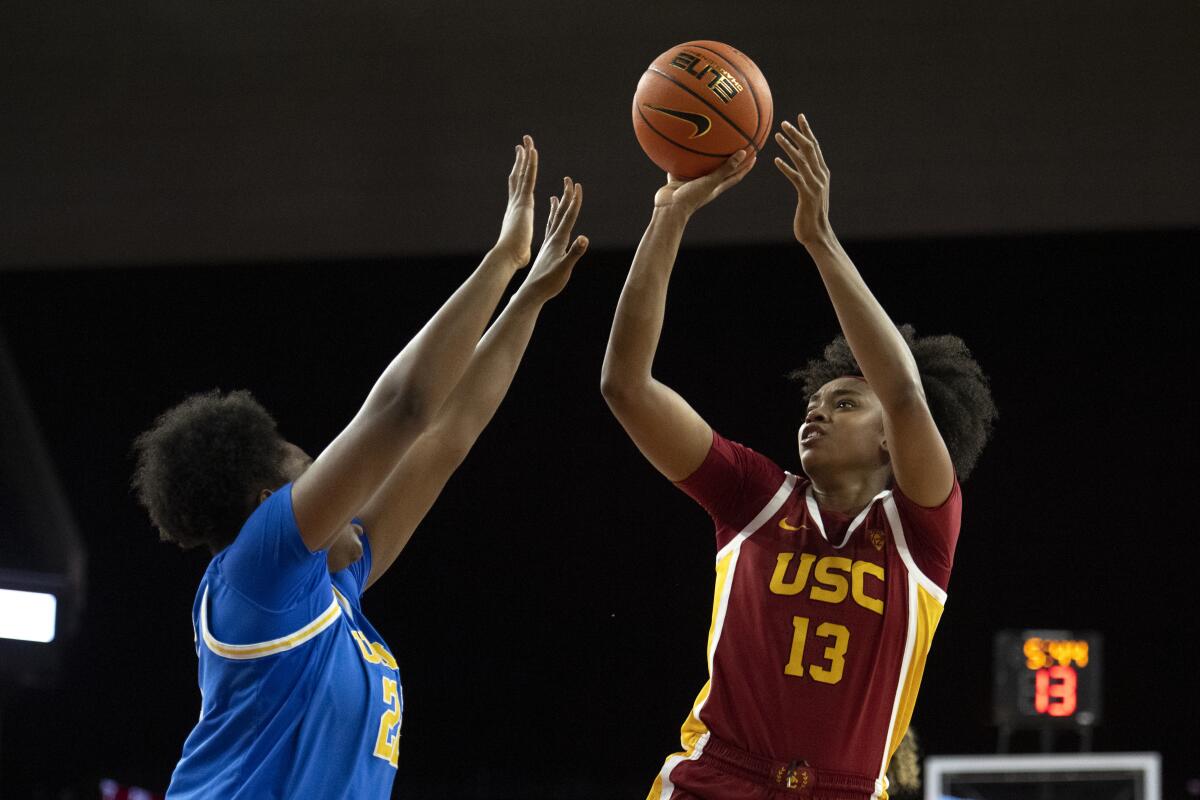 USC guard Rayah Marshall shoots over UCLA center Christeen Iwuala during a game.