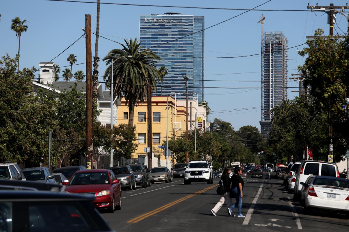 The Ritz-Carlton hotel and luxury residences in the background of the Pico-Union neighborhood in Los Angeles, May 2022. 