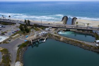 Carlsbad, CA - June 07: The area for the proposed new construction where the large filter screens are located and the discharge pond at the Carlsbad Desalination Plant on Tuesday, June 7, 2022 in Carlsbad, CA. (Nelvin C. Cepeda / The San Diego Union-Tribune)